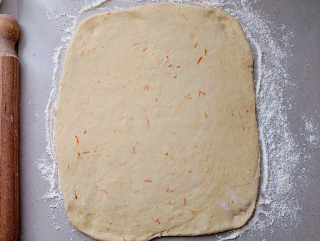 Rolling out the dough for orange cinnamon rolls