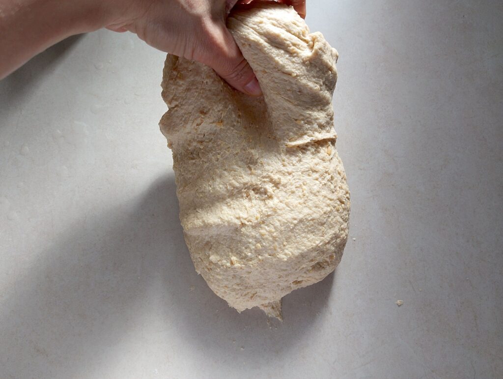 Performing stretches and folds on the dough