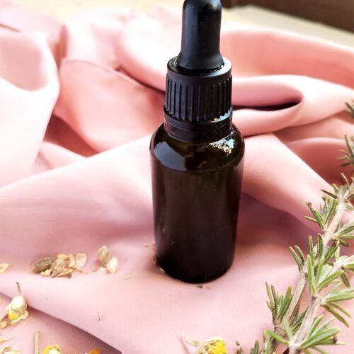 DIY Hair and Scalp Oil in amber dropper bottle