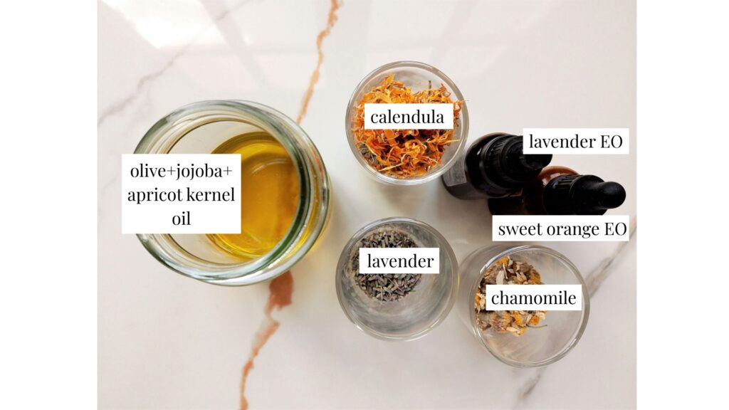 Ingredients for diy herbal body oil on the counter