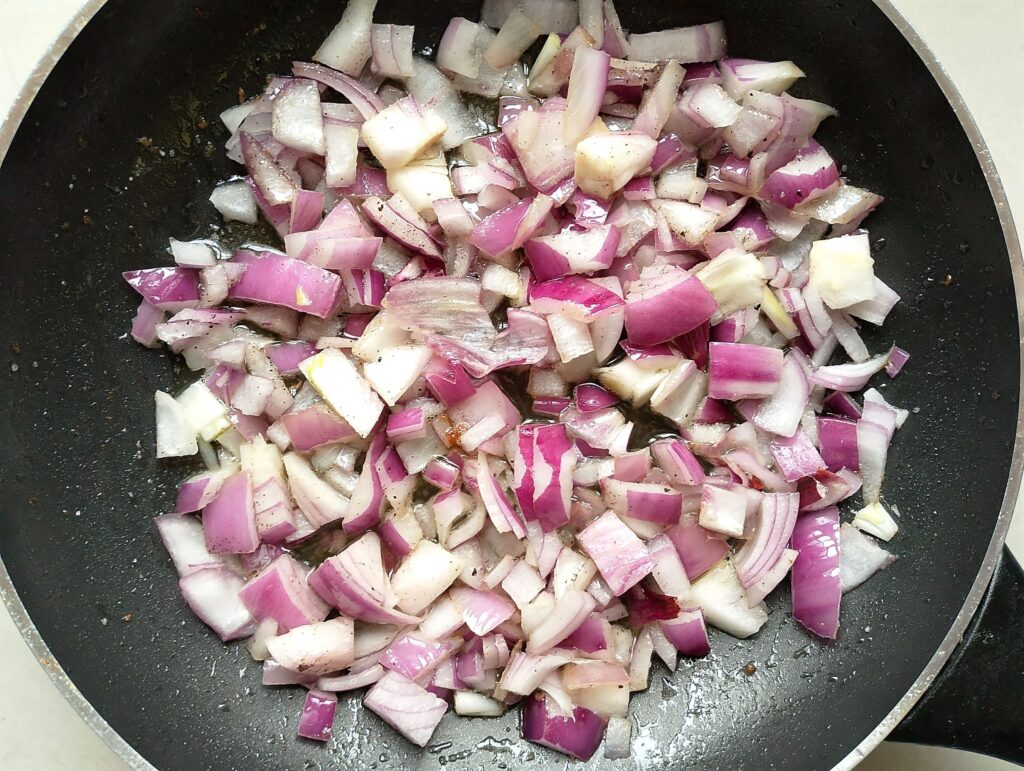 Sauteing onion in butter in a large skillet