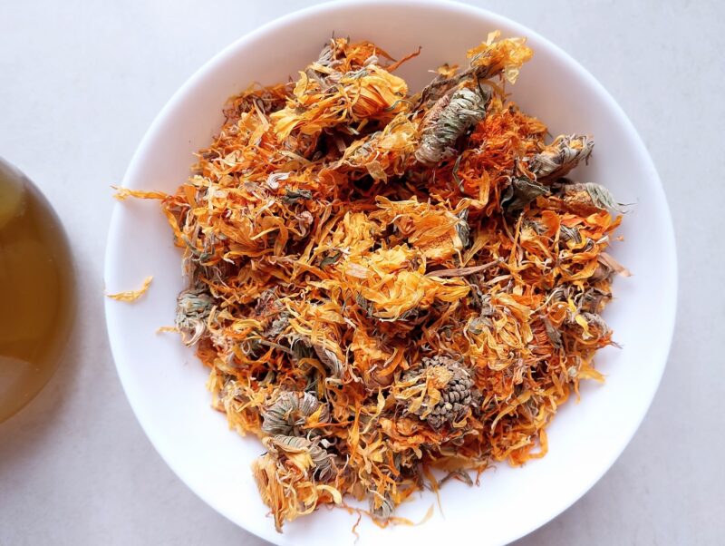Dried calendula flowers in a bowl