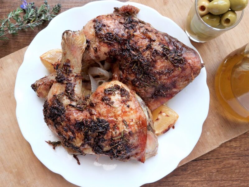 Rosemary lemon roasted chicken legs on a serving platter