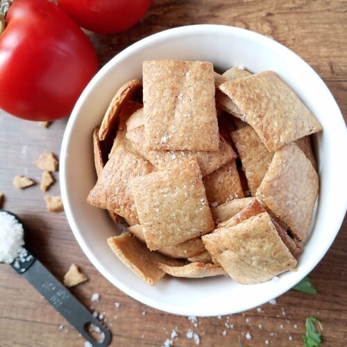 Sourdough crackers recipe: a bowl of sourdough crackers on a wooden table