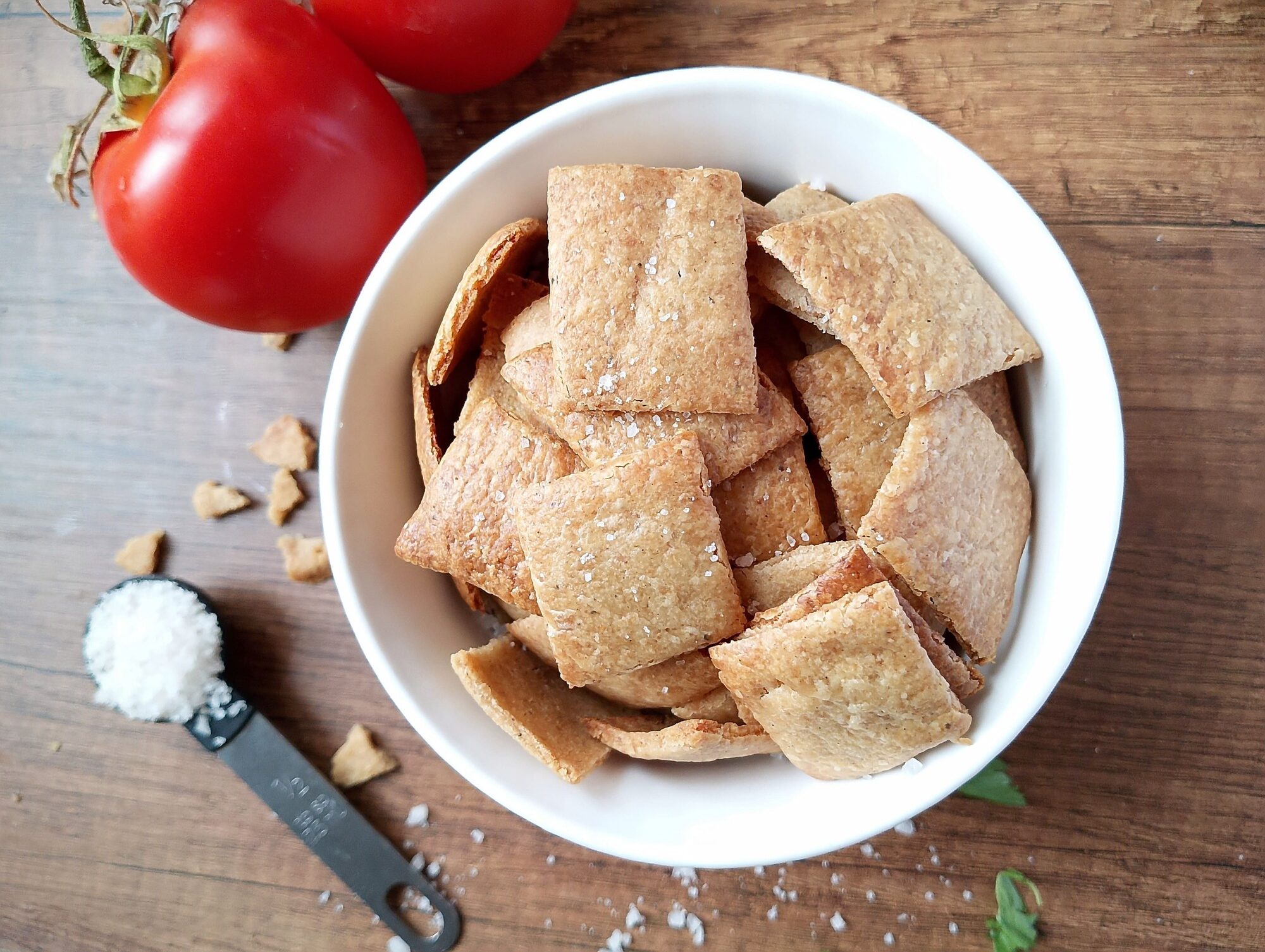 Sourdough crackers recipe: a bowl of sourdough crackers on a wooden table