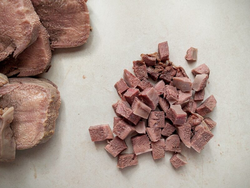 Chopping beef tongue for tacos