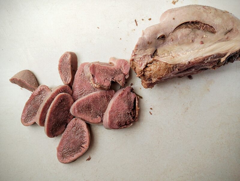 Slicing beef tongue for tacos