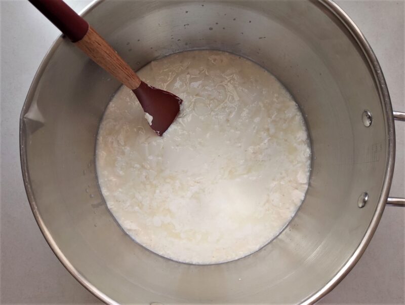 Clabbered milk in pot, ready to be heated on the stove