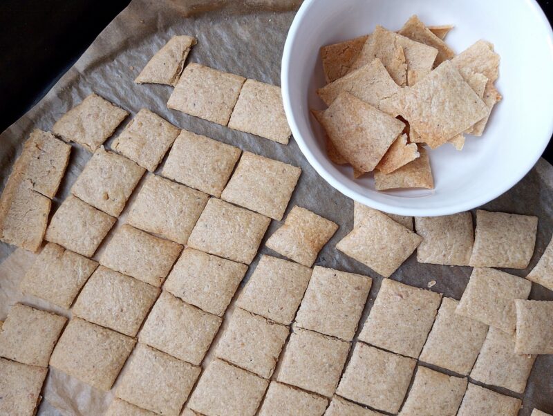 Removing some of the ready crackers into a bowl