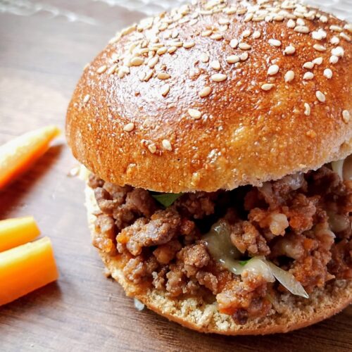 Chicken hearts sloppy joes on wooden board