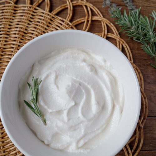 Whey ricotta cheese in white bowl