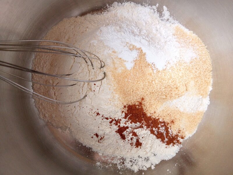 Mixing dry ingredients for sourdough discard scones in a bowl