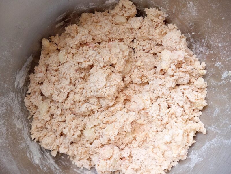 Adding wet ingredients to dry ingredients for scones