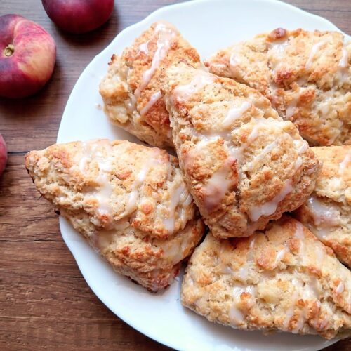 Peaches and cream sourdough discard scones on white serving plate