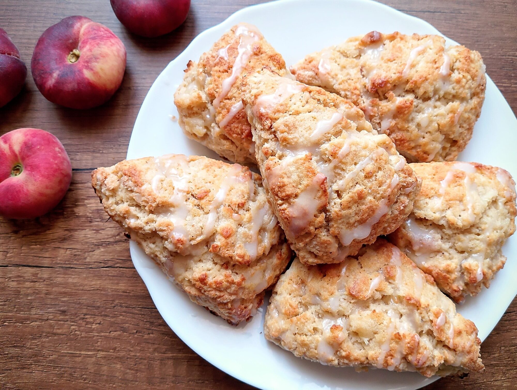 Peaches and cream sourdough discard scones on white serving plate