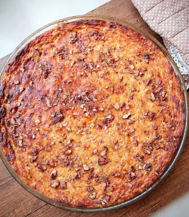Freshly baked cottage cheese breakfast bake cooling on a wooden board