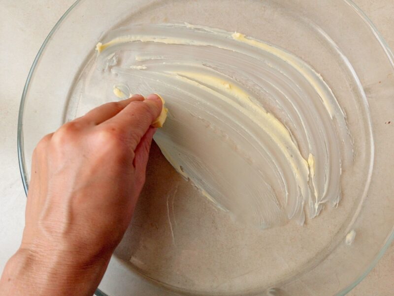Greasing baking dish with butter