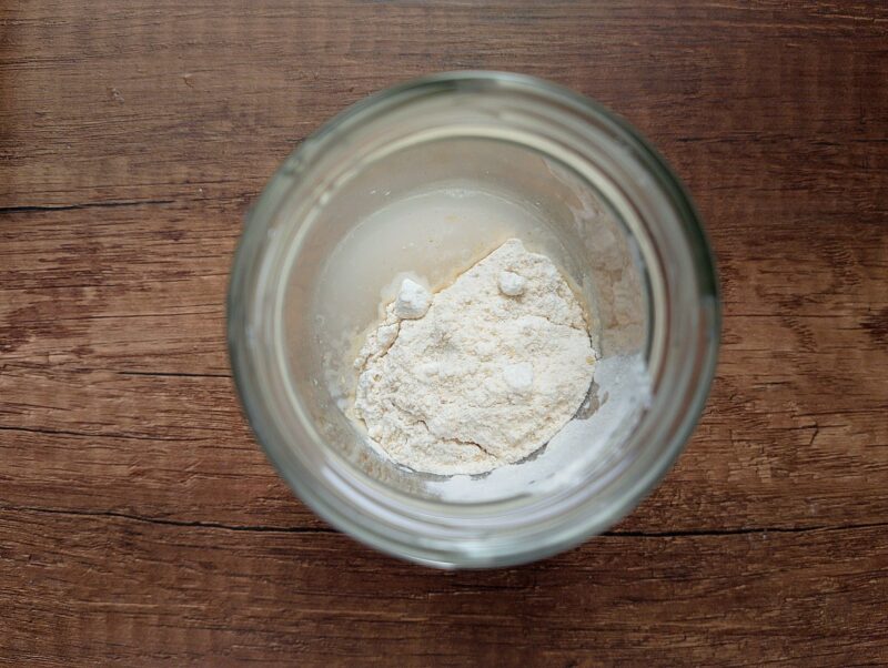 Flour and filtered water in jar, ready to be mixed