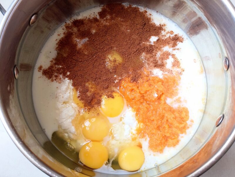 Adding wet ingredients and spices for cottage cheese bake to a mixing bowl