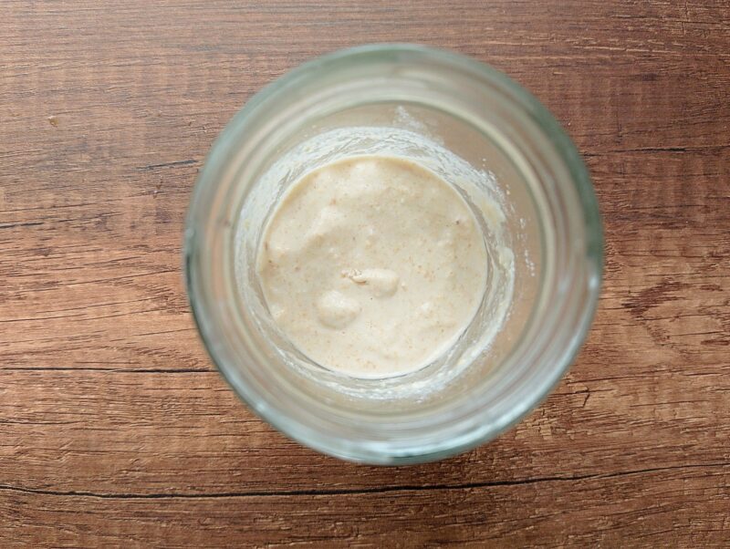 Water and flour mixed in jar to make a sourdough starter