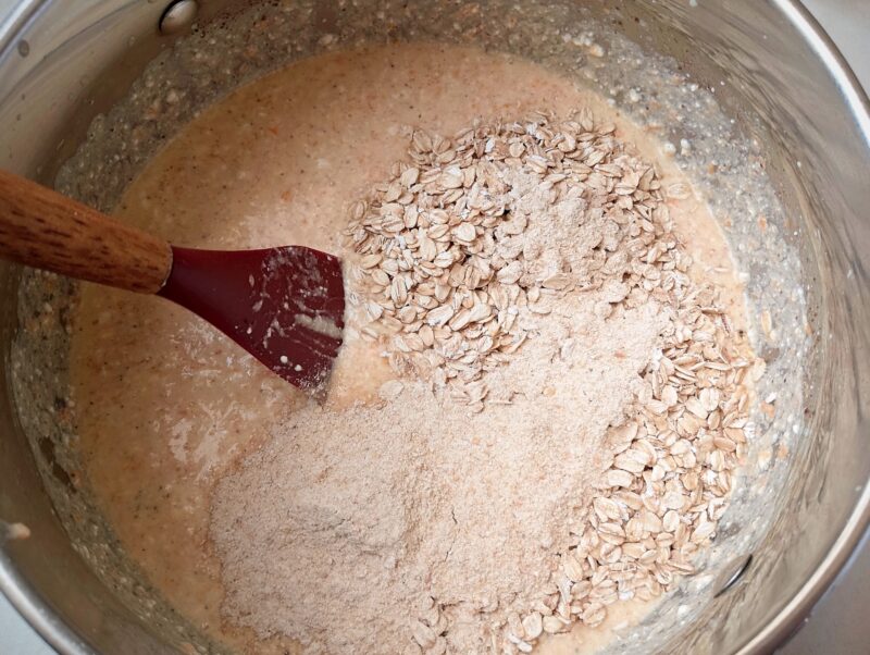 Adding oats and flour to wet ingredients for cottage cheese bake