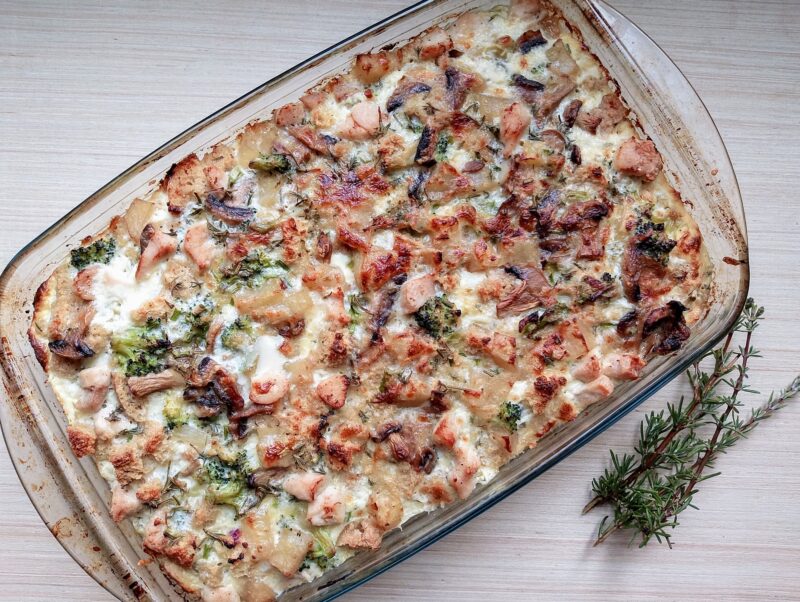 Savory bread mudding made with leftover bread and chicken in baking dish