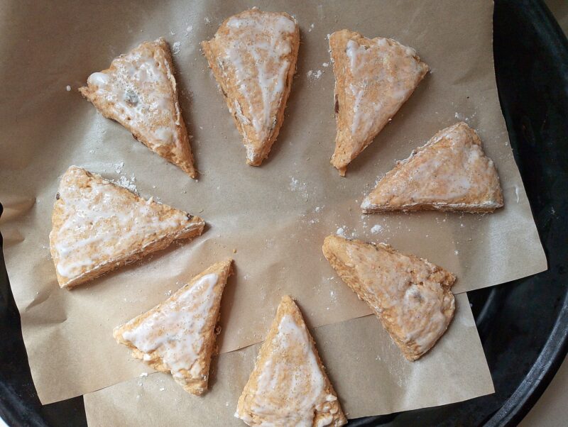 Glazing scones with yogurt and sprinkling with brown sugar