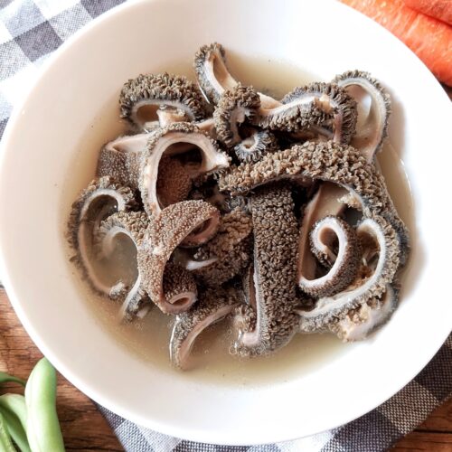 Cooked and sliced tripe in white bowl