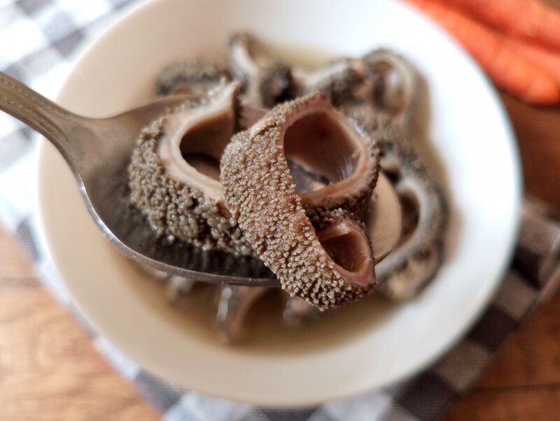 Slice of cooked tripe on spoon