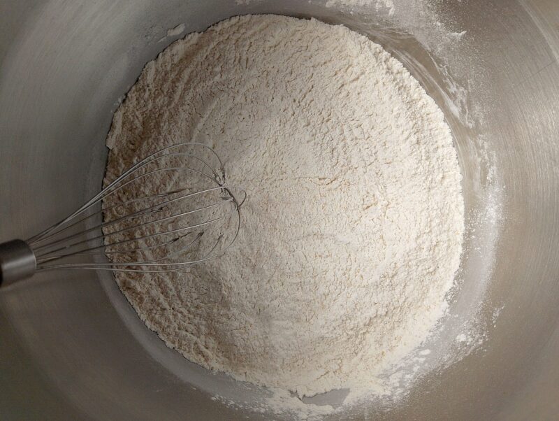 Whisking dry ingredients for sourdough scones in bowl