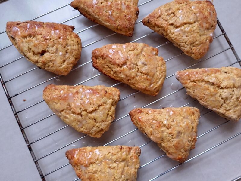 Glazed pumpkin scones cooling on wire rack