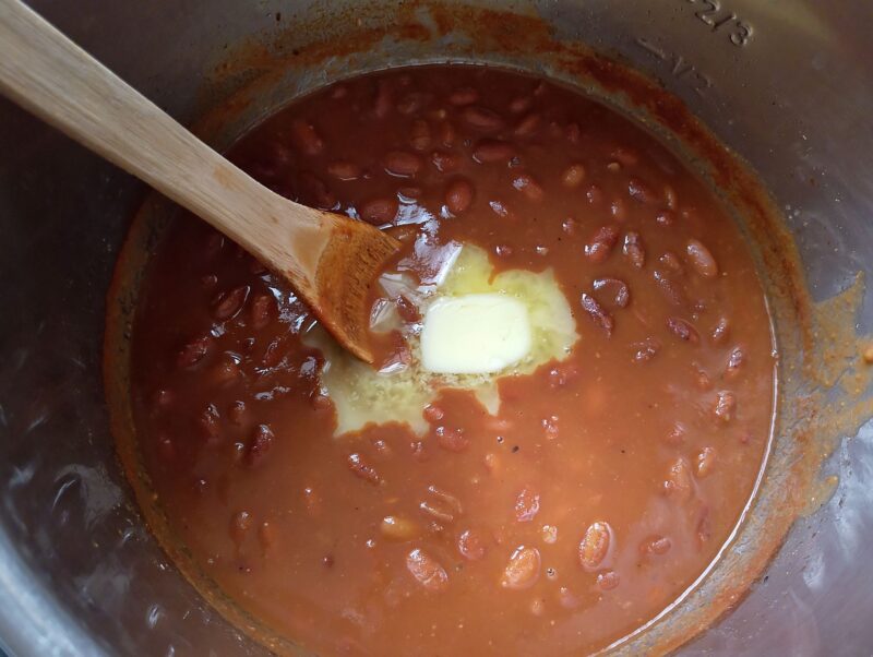 Stirring butter into baked beans in instant pot