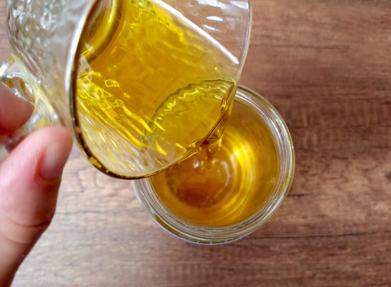 Adding calendula oil to melted tallow and cocoa butter