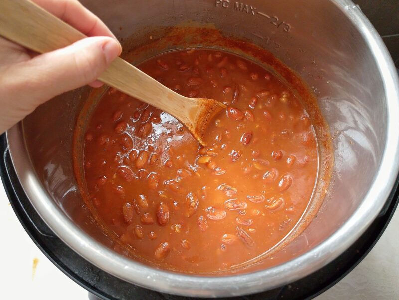 Adding tomato paste and seasonings to beans in instant pot
