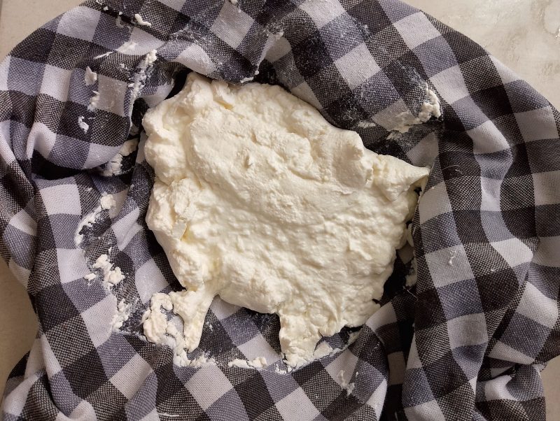 Drained yogurt cheese in tea towel