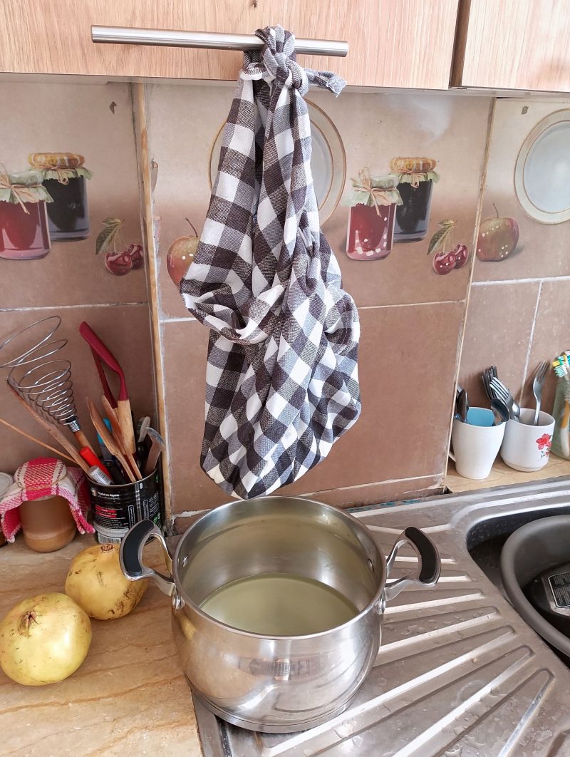 Hanging yogurt cheese to speed up draining process