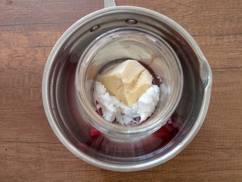 Melting tallow and cocoa butter in double boiler