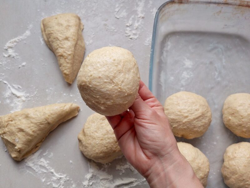 Shaping dough pieces into balls