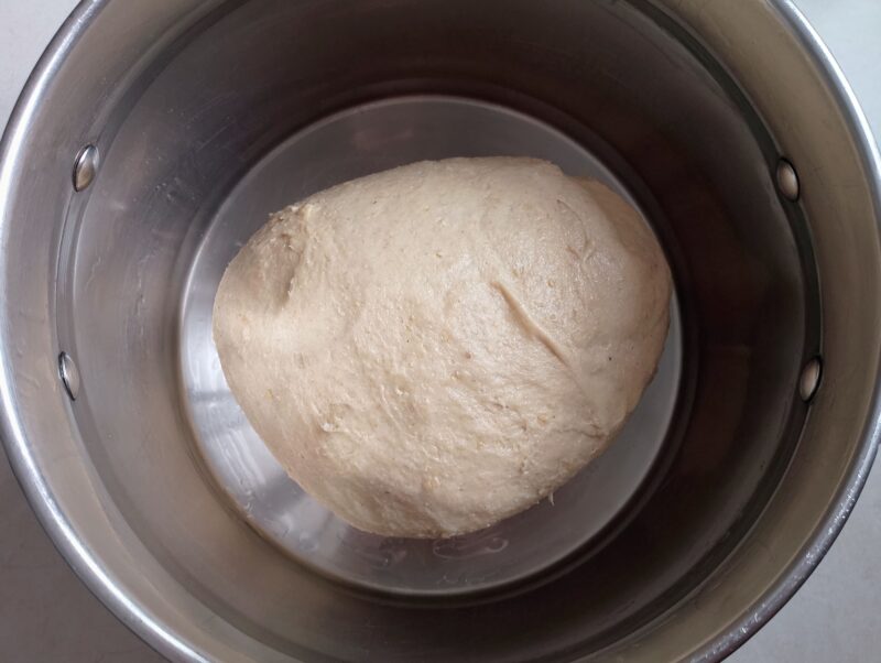 Sourdough rolls dough in oiled bowl ready for bulk ferment